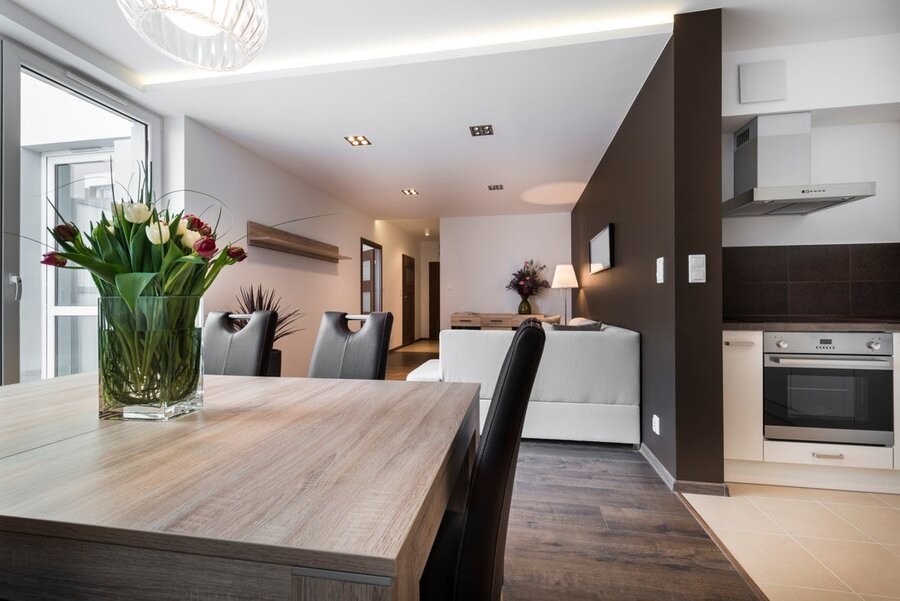A kitchen and dining area featuring several smart home lighting and automation.